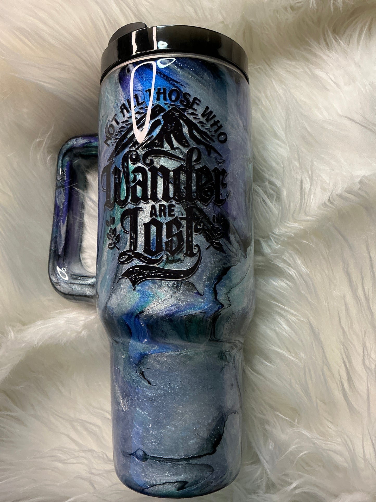 #653. 40 oz Not All Who Wander Are Lost: in a Abalone with Blues, Greens, & Purple