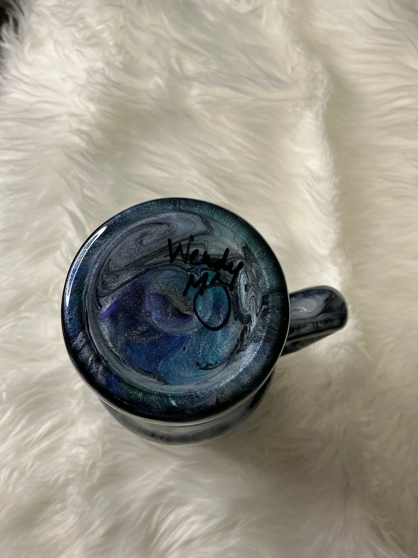 #653. 40 oz Not All Who Wander Are Lost: in a Abalone with Blues, Greens, & Purple