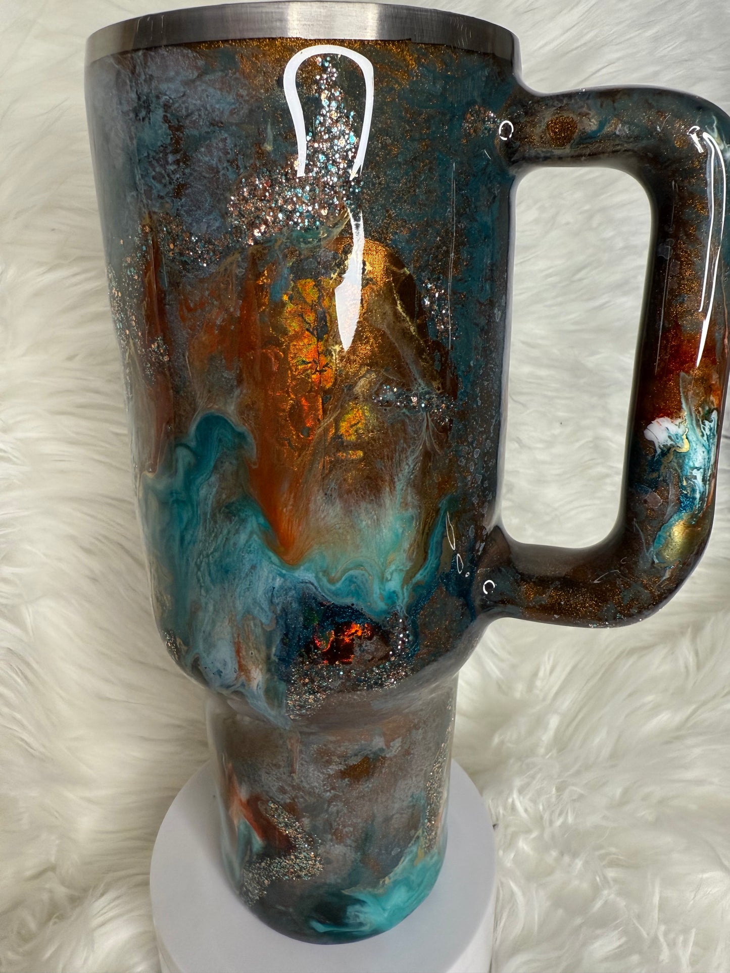 #704.  40 oz Traveler in a blue Patina with a Western Ink Swirl with Foil Accents