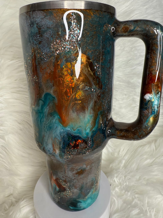 #704.  40 oz Traveler in a blue Patina with a Western Ink Swirl with Foil Accents